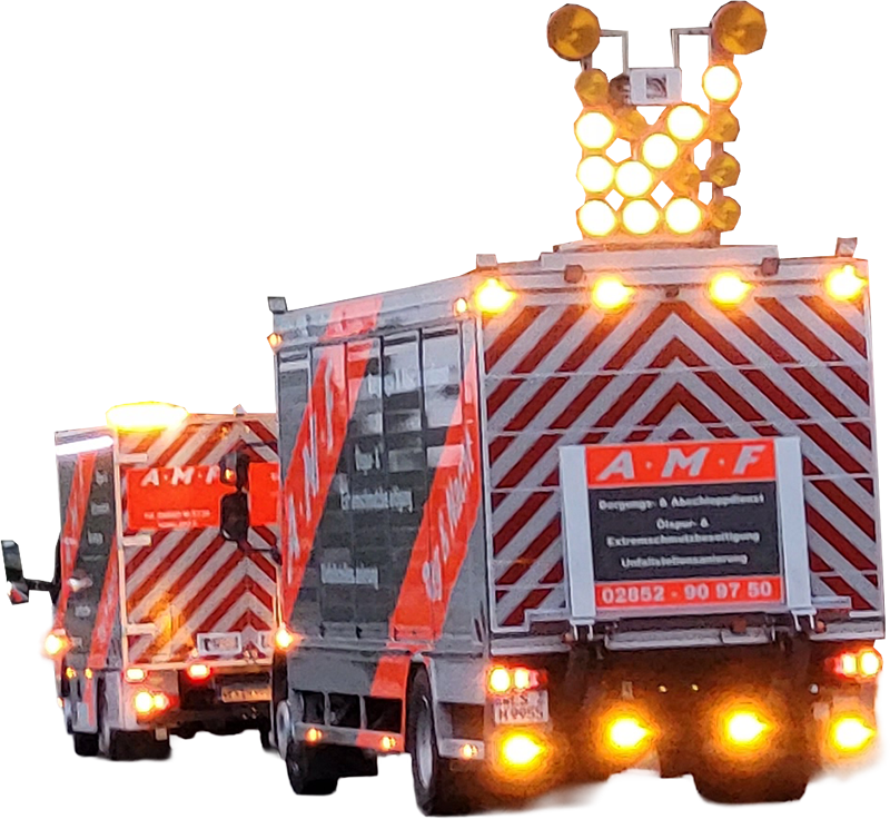 Zwei Reinigungsfahrezeug der AMF fahren mit eingeschalteten Warnlichtern hintereinander.